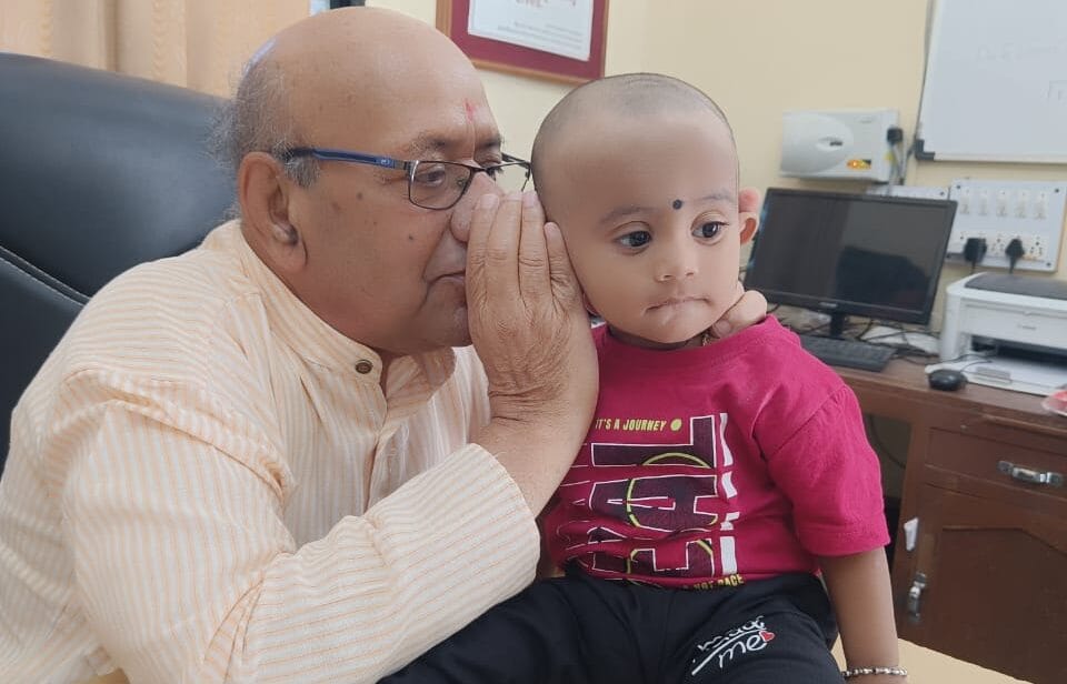 Physician examine and playing with child