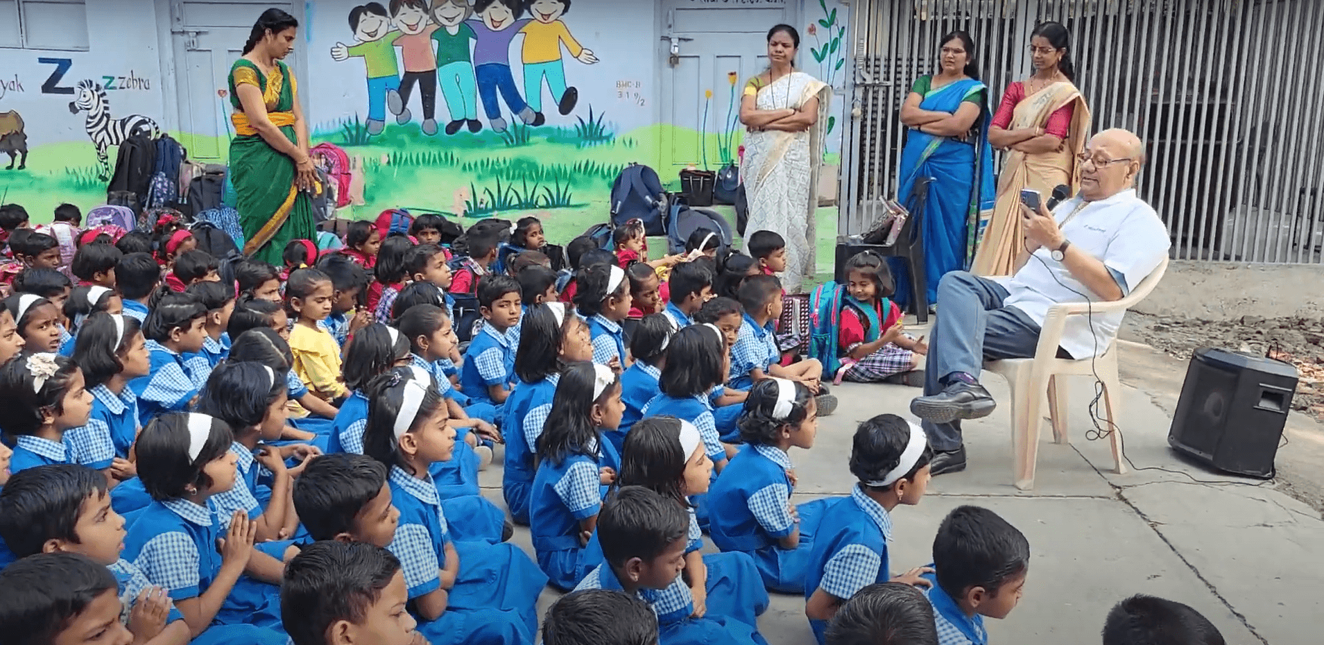 Dr. Anil mokashi telling stories to children