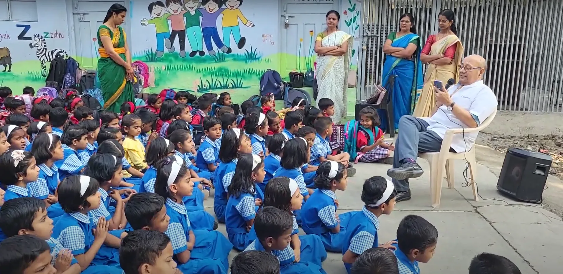 Dr. Anil mokashi telling stories to children