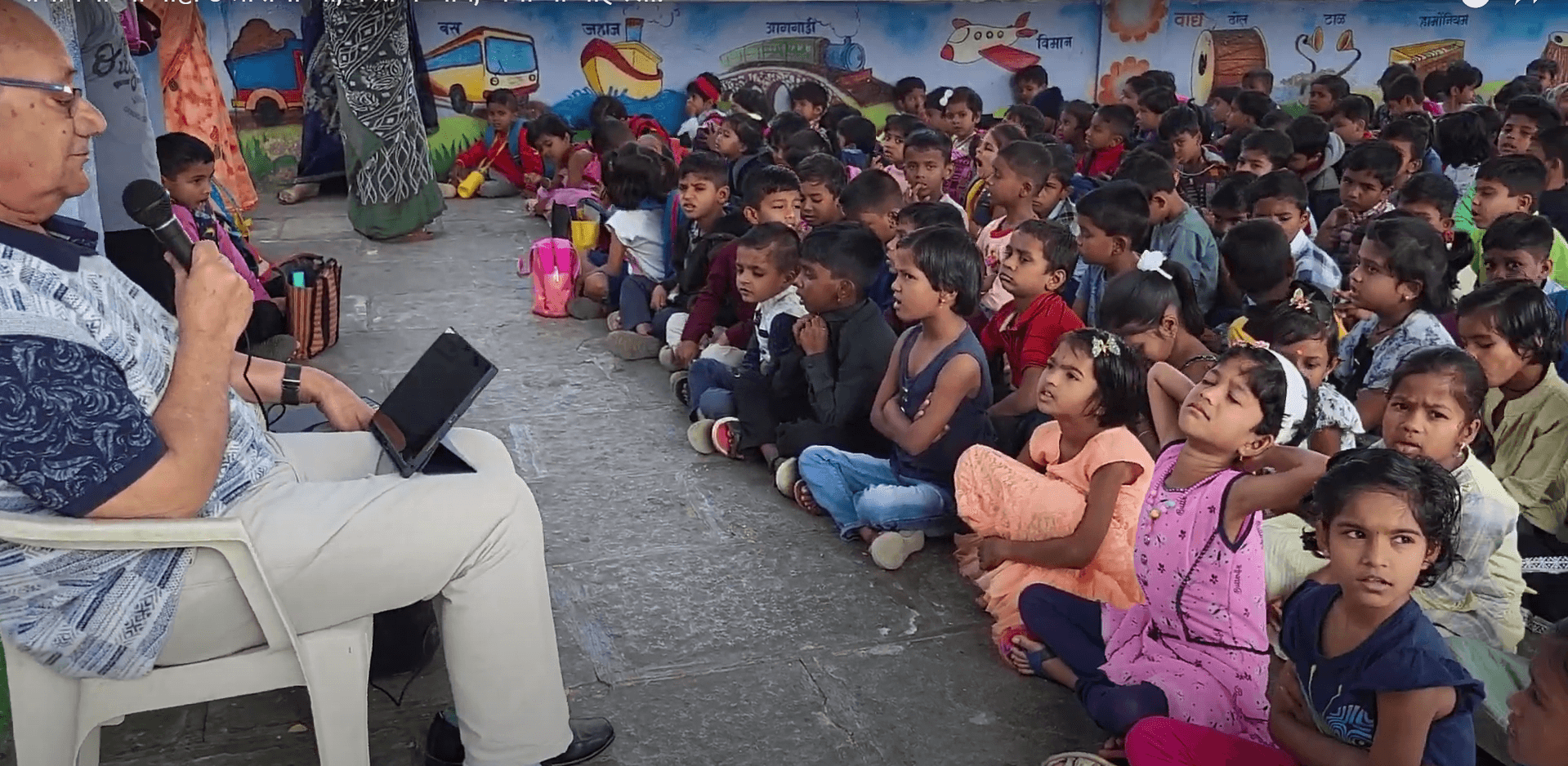 Dr. Anil Mokashi telling stories to children