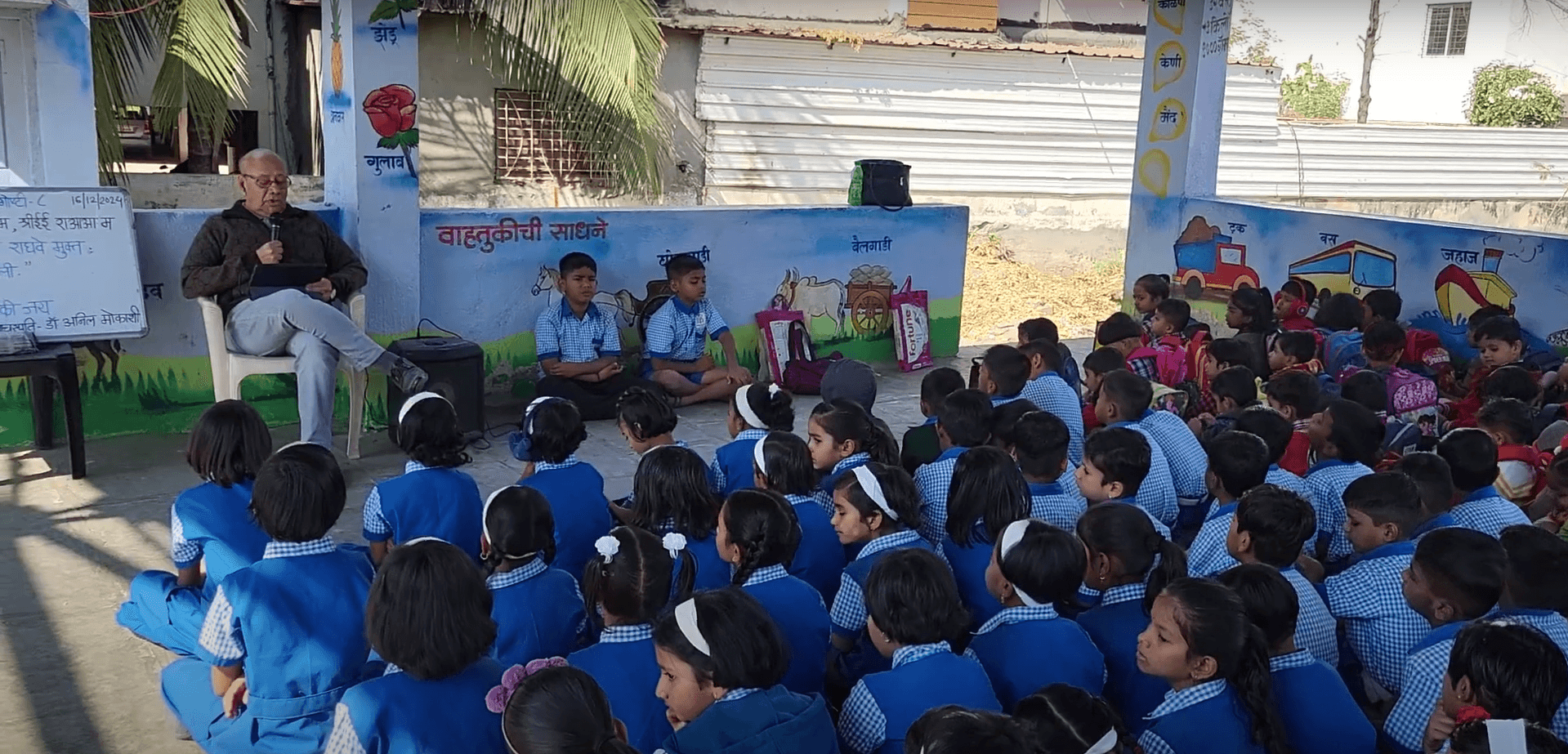 Dr. Anil Mokashi telling stories to children