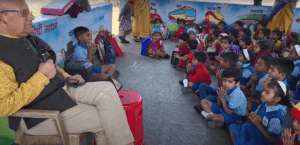 Dr. Anil Mokashi telling stories to children