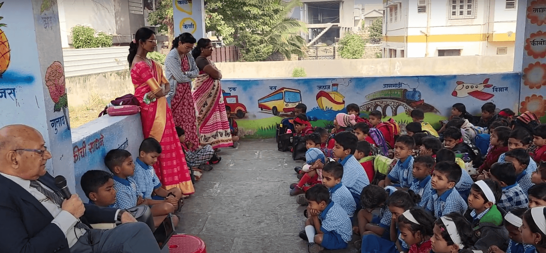 Dr. Anil Mokashi telling stories to children