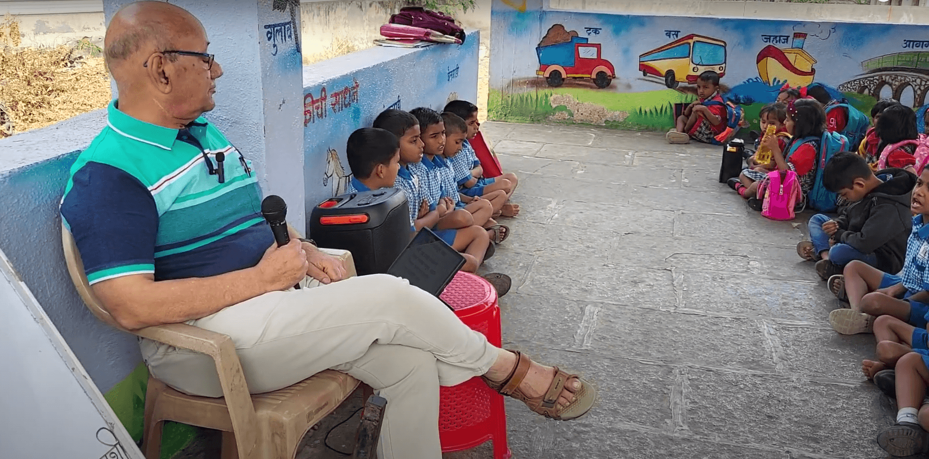 Dr. Anil Mokashi telling stories to children