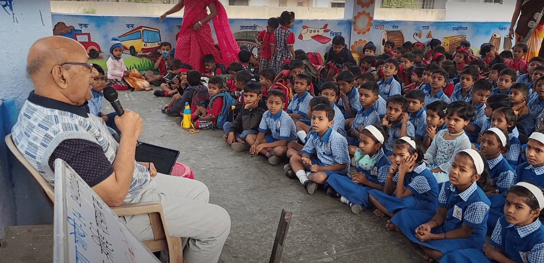 Dr. Anil Mokashi telling stories to children