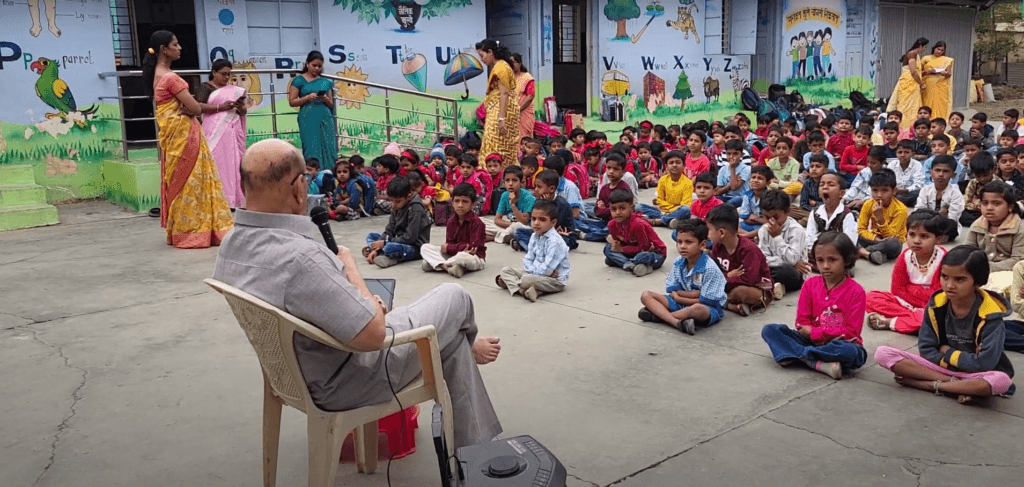 Dr. Anil Mokashi telling stories to children Dr. Anil Mokashi telling stories to children