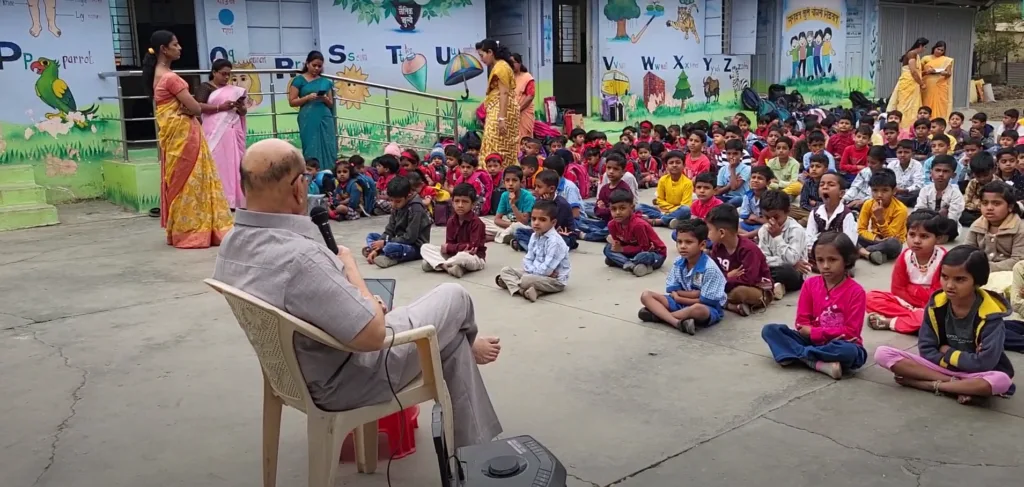 Dr. Anil Mokashi telling stories to children