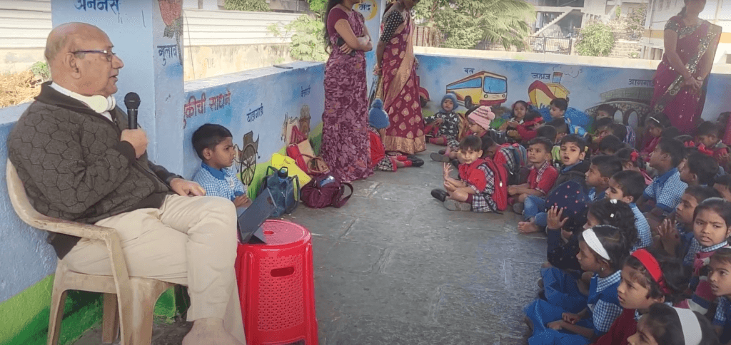 Dr. Anil Mokashi telling stories to children