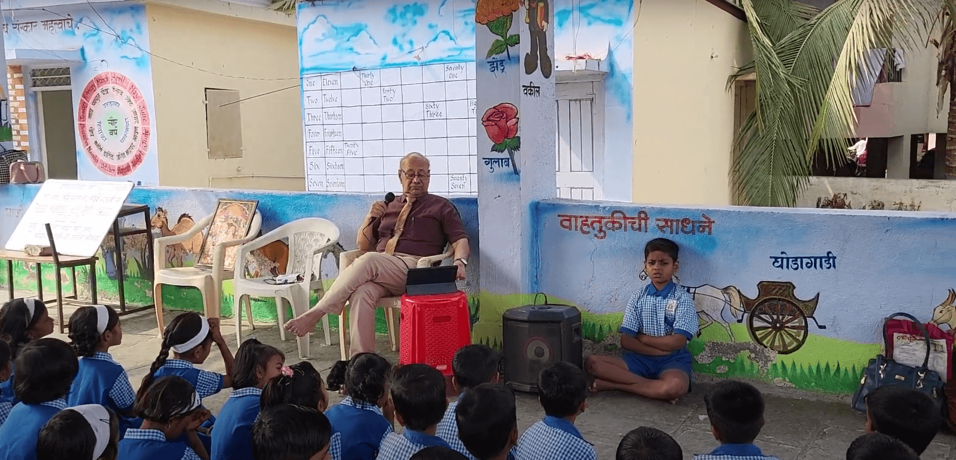 Dr. Anil Mokashi telling stories to children