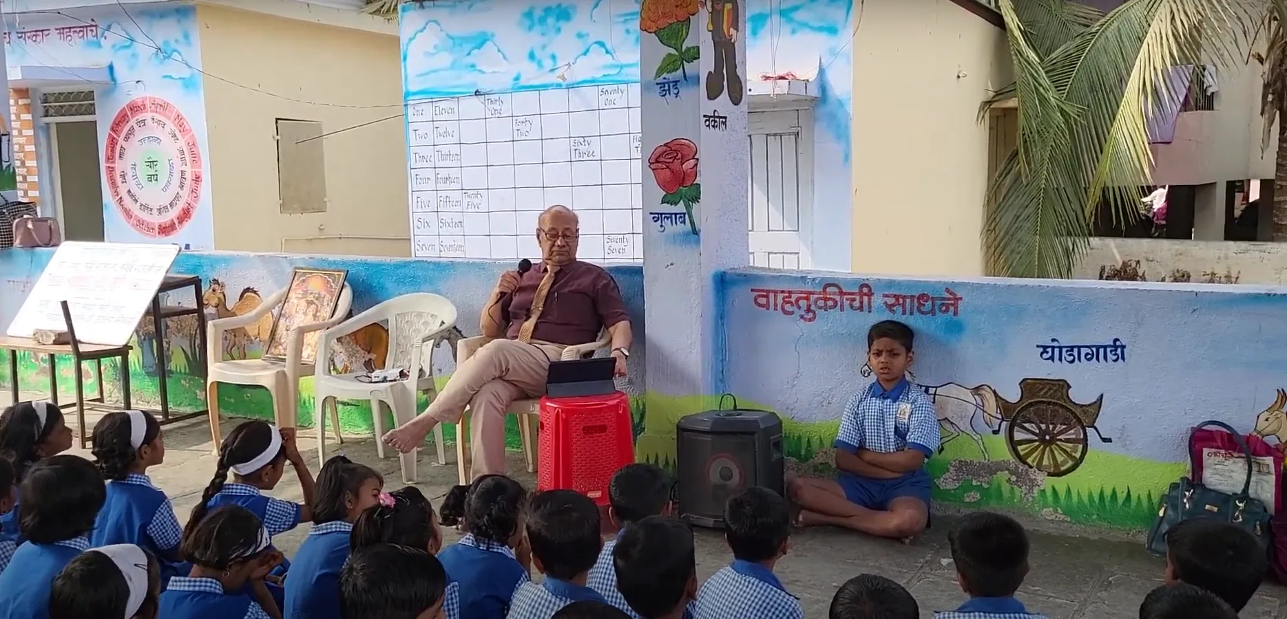 Dr. Anil Mokashi telling stories to children