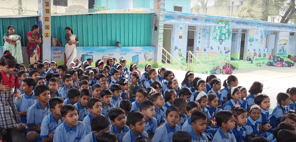 Dr. Anil Mokashi telling stories to children