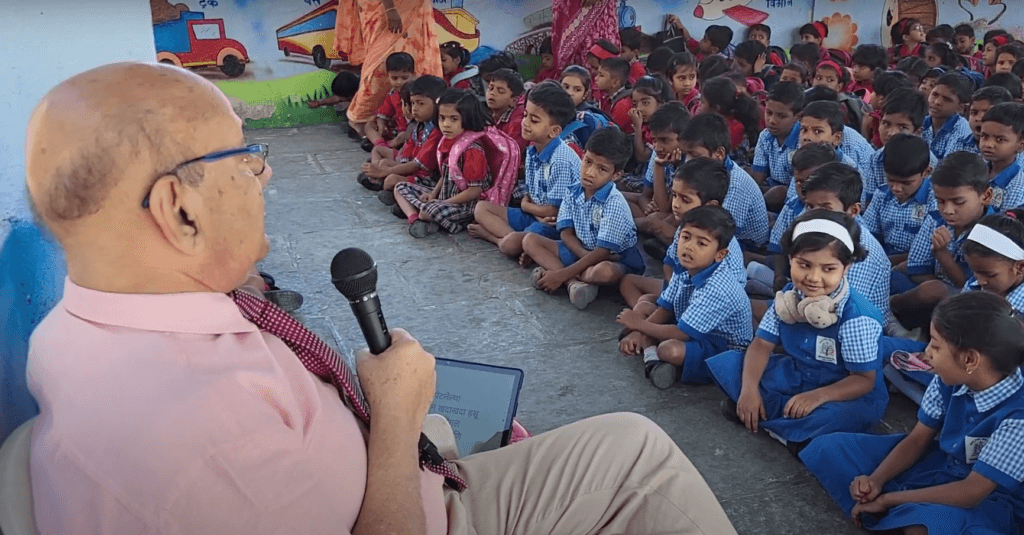 Dr. Anil Mokashi telling stories to children