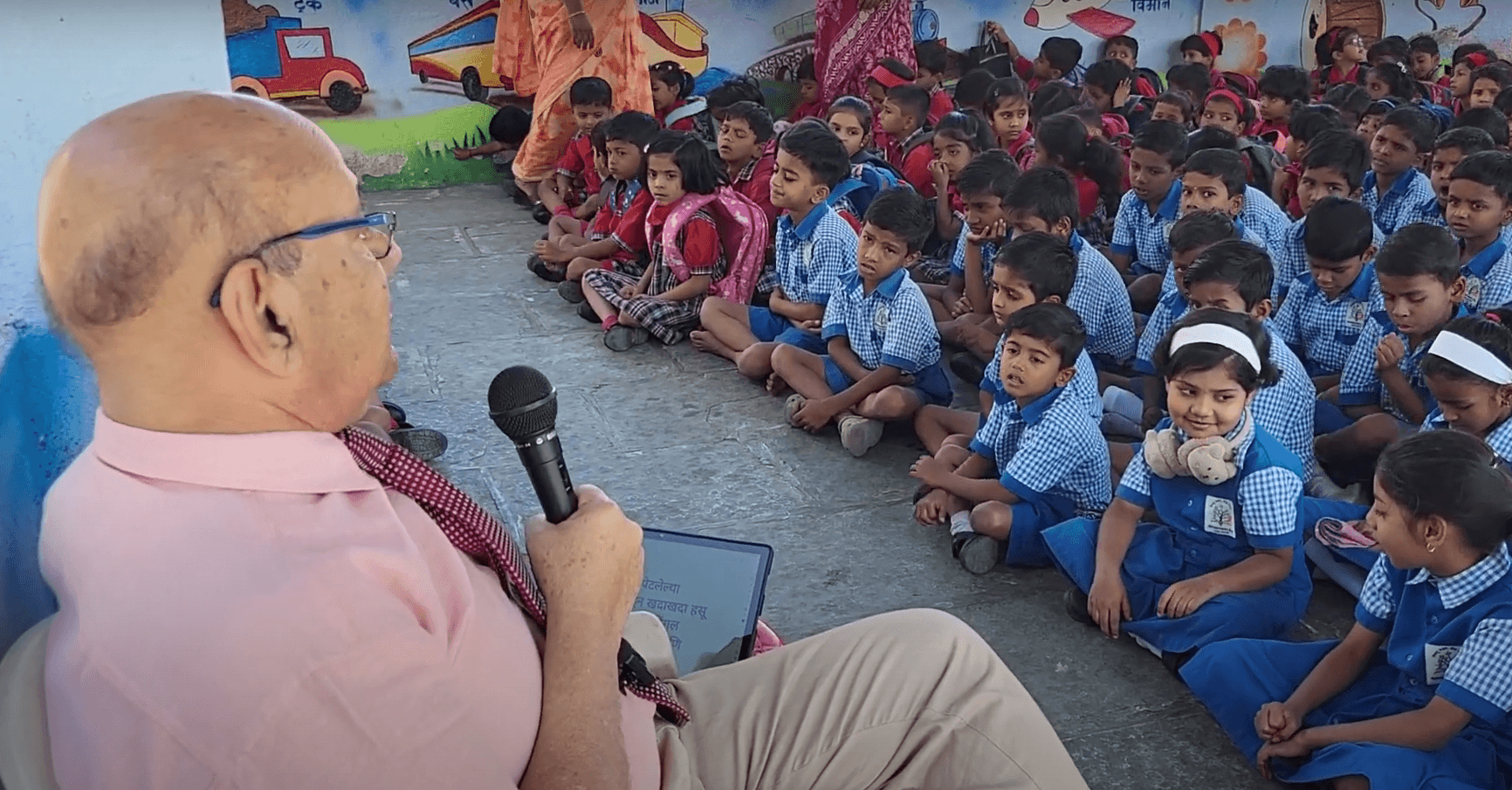 Dr. Anil Mokashi telling stories to children