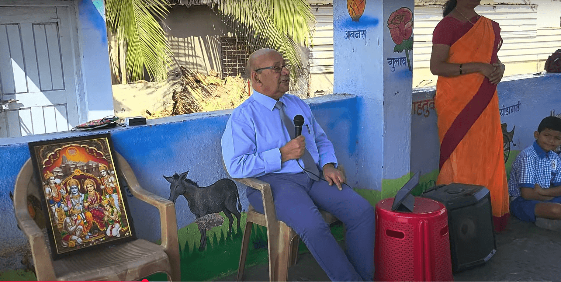 Dr. Anil Mokashi telling stories to children