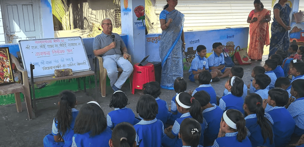 Dr. Anil Mokashi telling stories to children