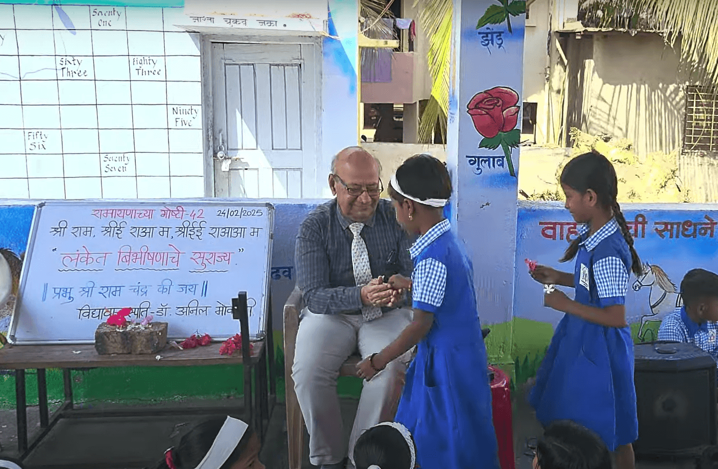 Dr. Anil Mokashi telling stories to children
